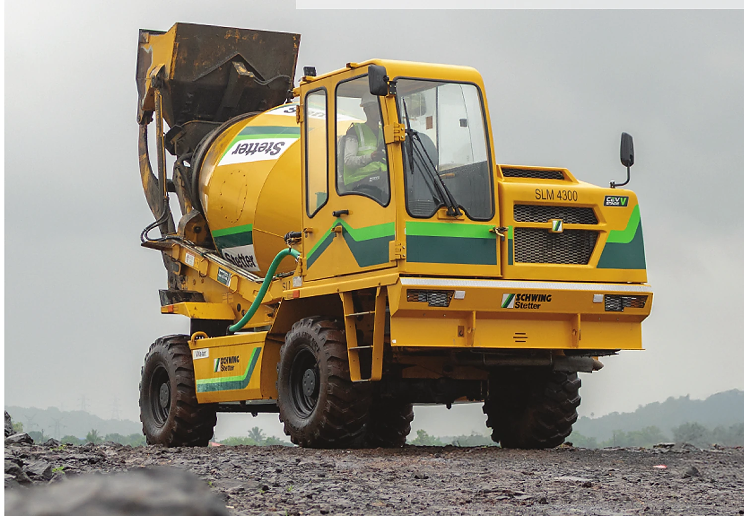 SCHWING Stetter self-loading mixer operating on a construction site