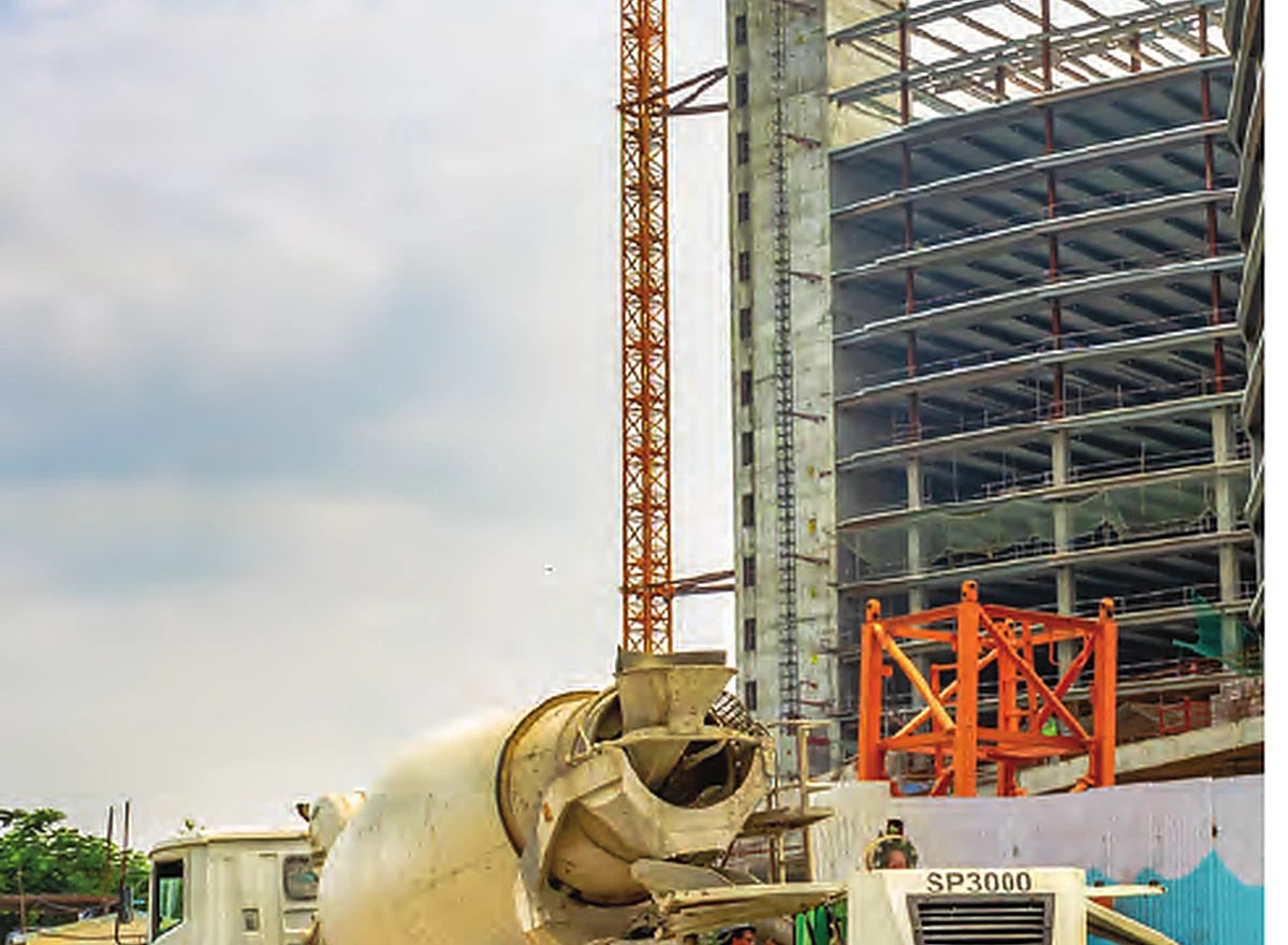 Stationary concrete pump working at a high-rise project