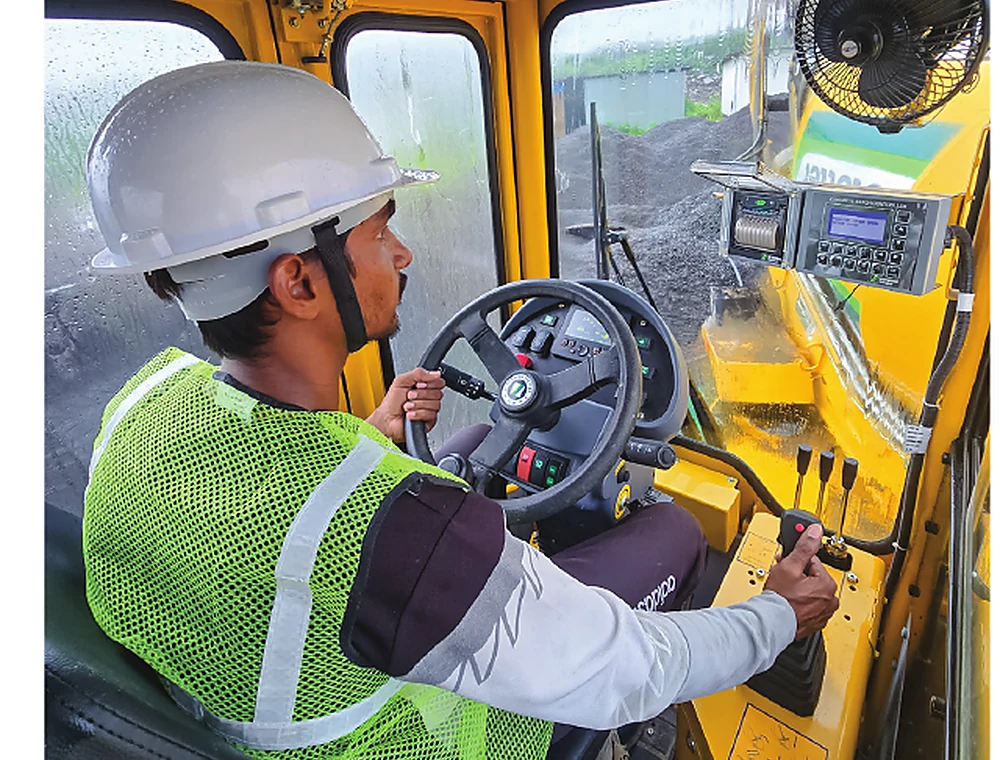 Operator inside a SCHWING self-loading mixer cabin